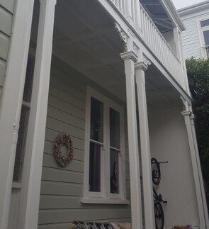 Exterior house restoration and painting of a 2 storey iconic bungalow