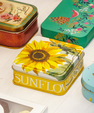 Traditional tin with printed yellow sunflower on the lid