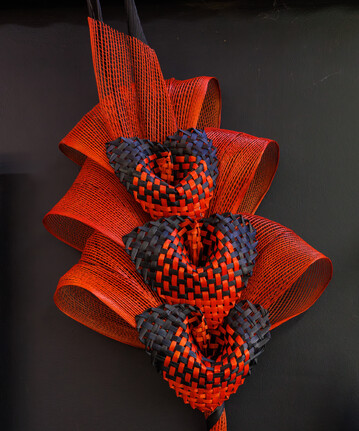 A red bouquet hand-made with woven flax. Also known as a Harakeke