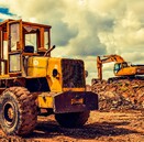 Loader and excavator digger on work site earthworks