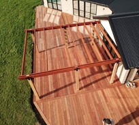 Aerial view of a freshly completed hardwood deck with pergola framing – premium craftsmanship by deck builders in Christchurch and North Canterbury.