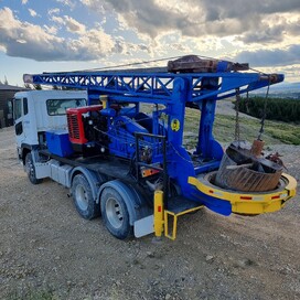 Rear view of a Kaiapoi Drilling truck featuring a large rotary drill bit – specialist drilling services North Canterbury for civil and foundation projects.
