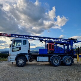 Kaiapoi Drilling truck with mounted rotary rig parked on a hillside – expert drilling and earthworks contractors North Canterbury.