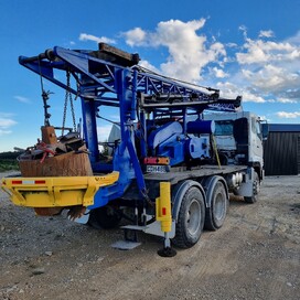 Close-up rear view of a drilling rig truck with a large auger bit – Kaiapoi Drilling delivering expert foundation and earthworks services in Canterbury.