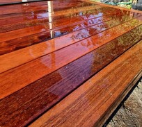 Close-up of a freshly oiled hardwood deck showcasing rich timber tones – finished by skilled deck builders in North Canterbury.