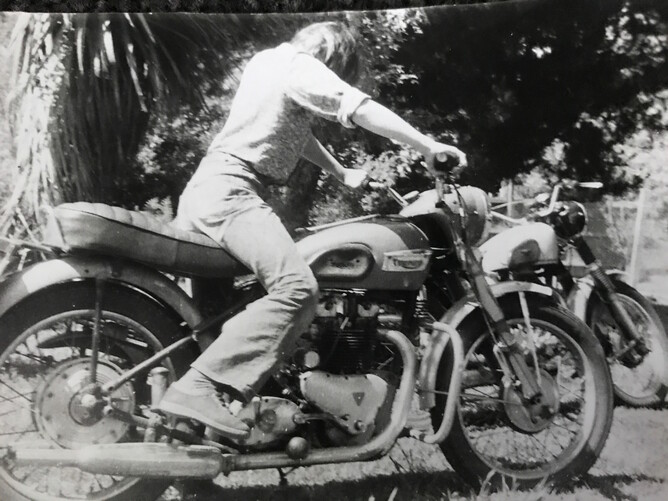 Me as a youngster trying out my big brothers triumph T500. The Matchless in the background. He told me once if I could start the Matchless I could take it for a ride. I never did manage to kick that beast over, but then he never did tell me about the decompression lever