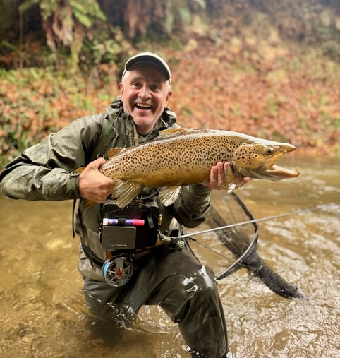 Ollie Bassett Fly Fishing guided trip client with trophy 10lb brown trout Rotorua streams