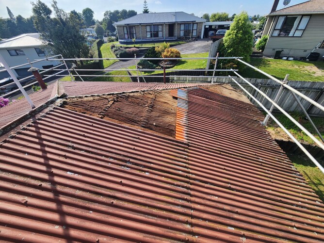 Weathered long-run metal roof over 30 years old