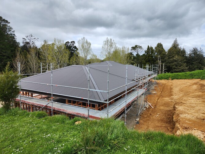 Roofing team installing a new roof on a Cambridge property