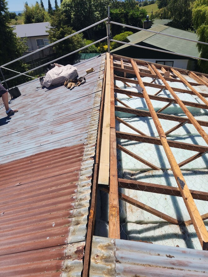 Weathered long-run metal roof over 30 years old