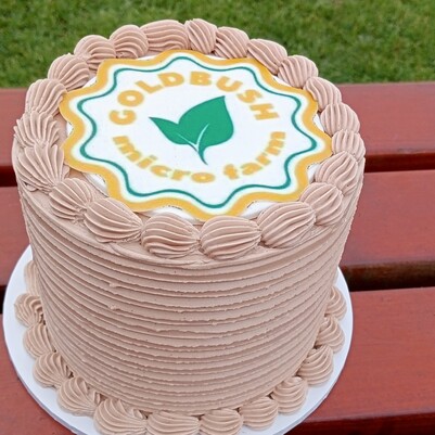 Cake with Goldbush Micro Farm Logo