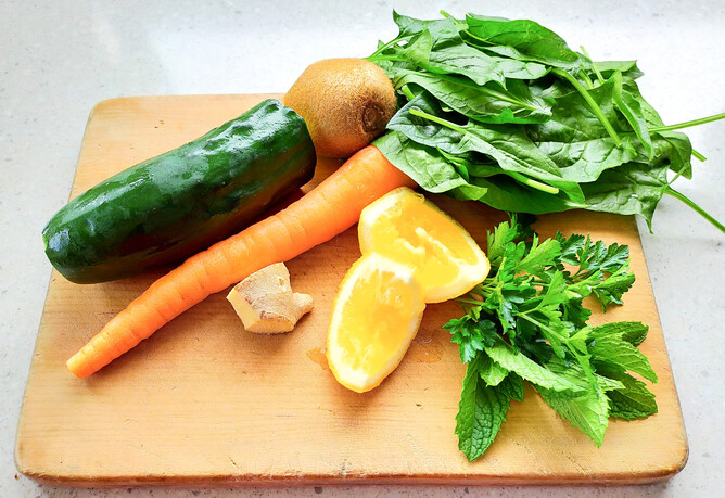Vegetables for smoothie on chopping board