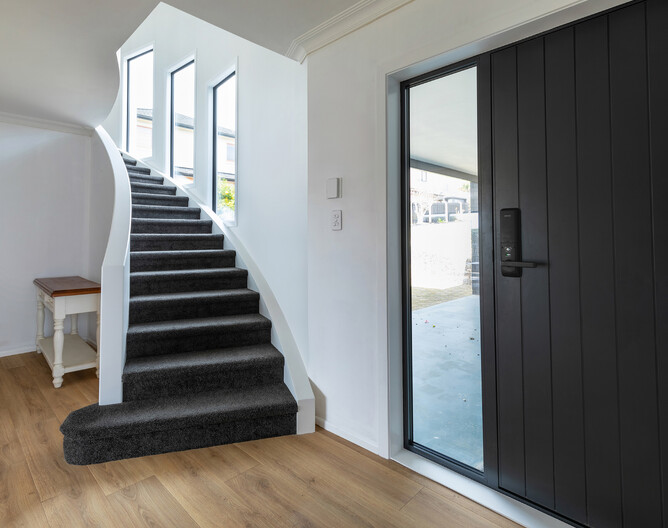 AFTER: The laminate floor in the entrance creates a lovely, warm welcome. It's also a durable choice for high foot traffic areas.