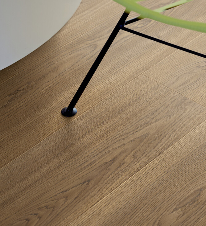 Close up image of Pergo Drammen Laminate Flooring featuring authentic oak look wood grain and textures