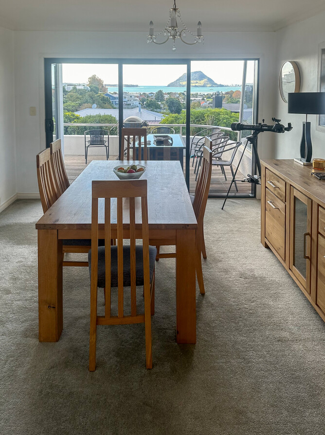 BEFORE: The kitchen and dining area previously featured kitchen tiles and a carpeted dining area which was difficult to keep clean.