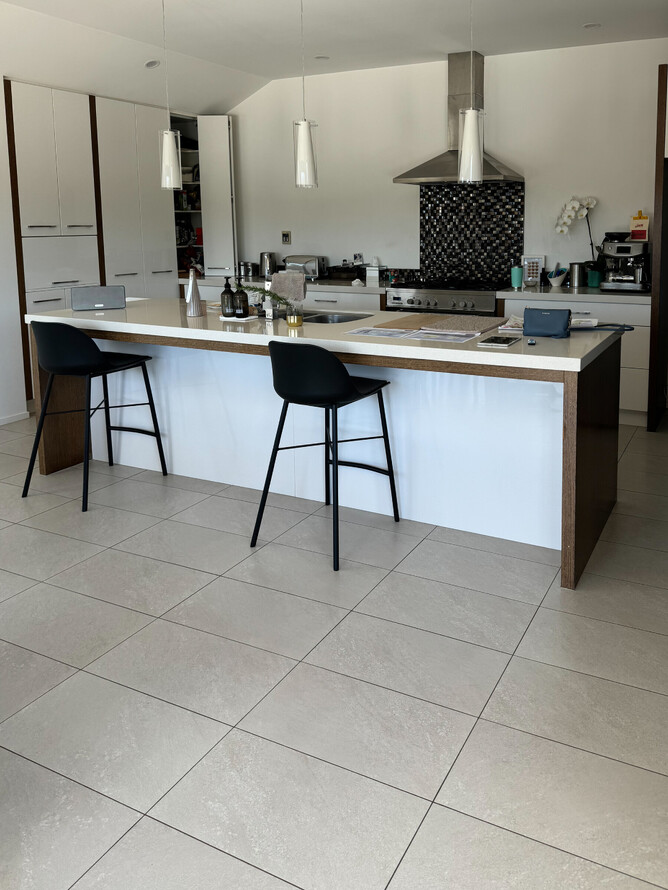 BEFORE: Original kitchen with tile floor.