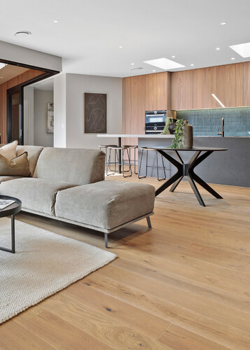 Natural oak flooring in a modern kitchen and lounge.