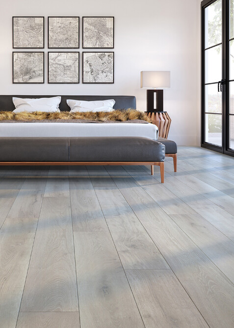 Grey Cork flooring in the style of wood planks. Image shows the hard flooring in a bedroom.