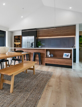 Interior image showing Quick Step Majestic flooring installed in a kitchen and dining room.