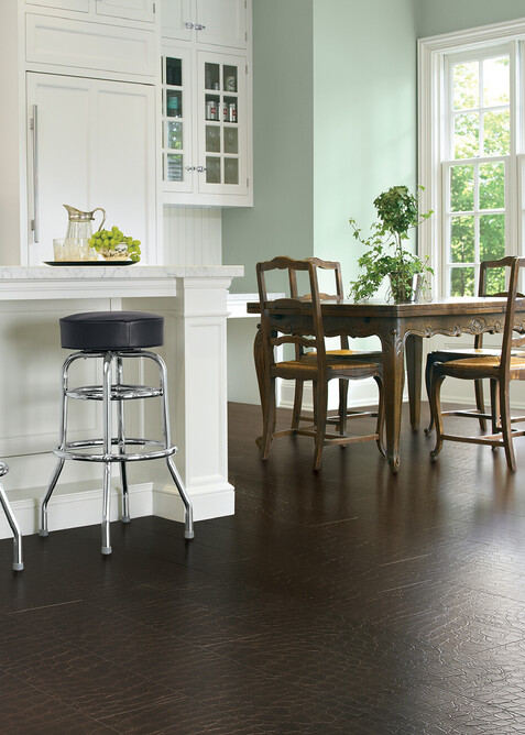 A textured dark brown leather floor in a country style home.