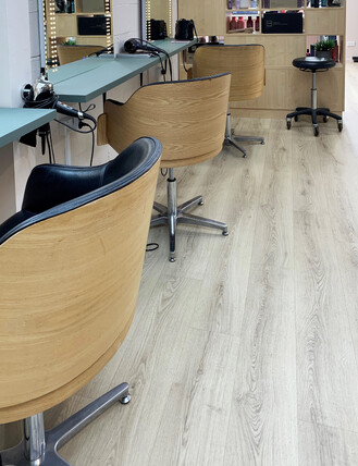 Grey laminate flooring in a hair salon.