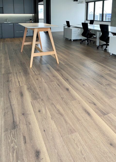 Brown corkwood floor in an office setting. Corkwood planks look similar to timber.