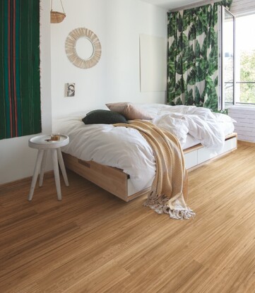 Waterproof hybrid vinyl floor in a modern bedroom.