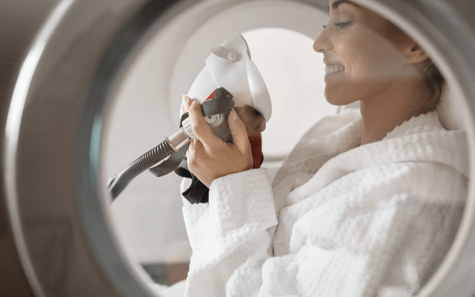 Woman in hyperbaric chamber boosting oxygen for tissue repair