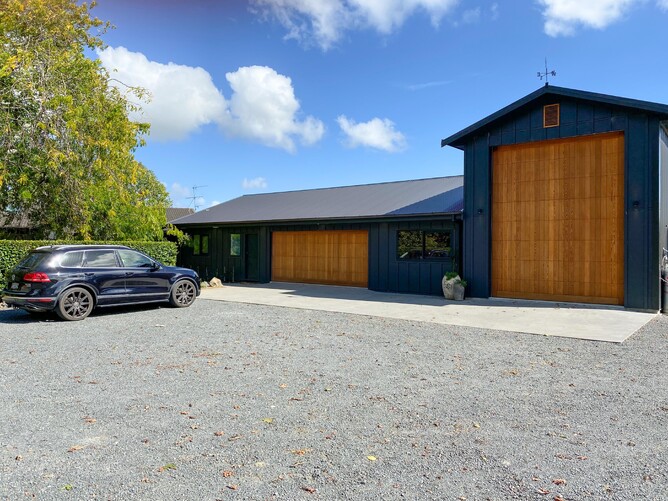 The barn entrance with garaging and truck storage
