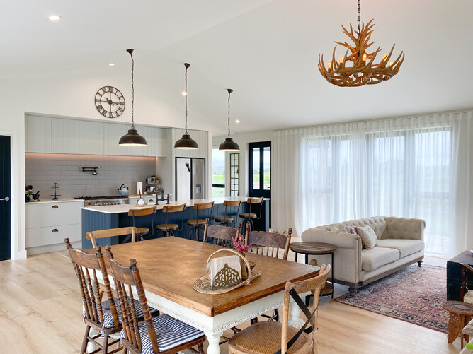 Open plan living space showing kitchen, dining and living area