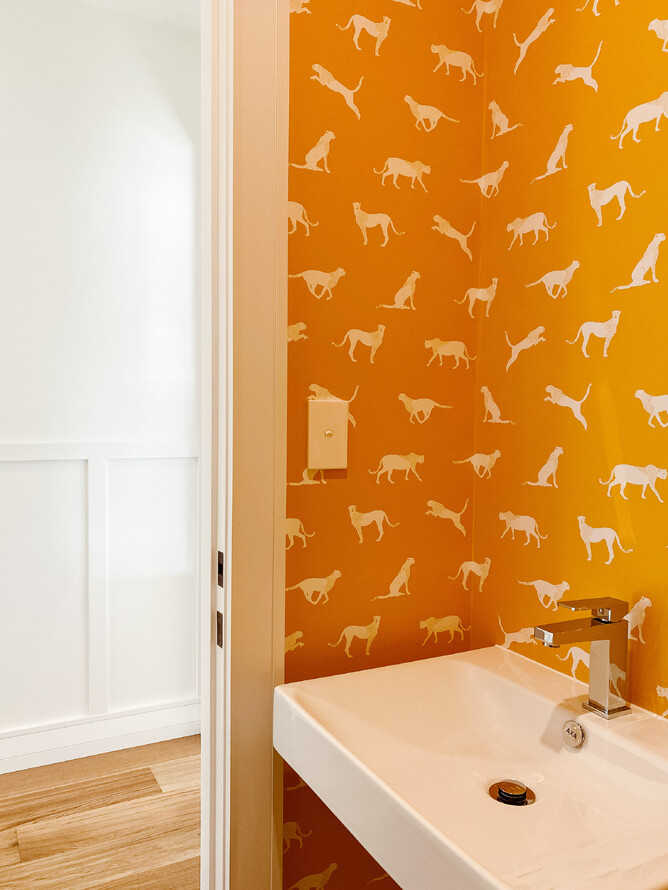 Bright feature wallpaper in the separate toilet