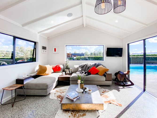 Minor Dwelling lounge area opening to pool area from glass sliding doors