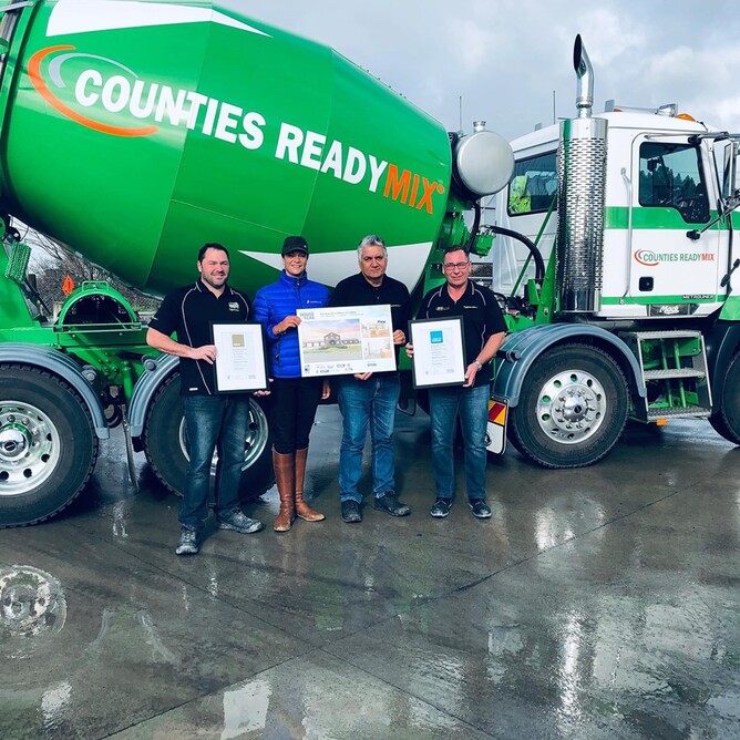 Laura Daly with Kyle Dunn, Paul Tapola & Willie Moreland from Counties Ready Mix