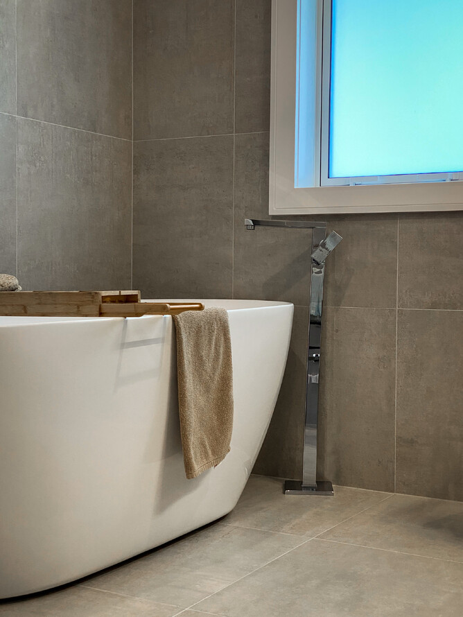 A free standing bath in the main bathroom