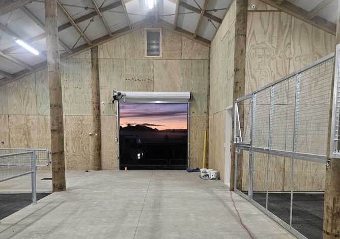 Breezeway of stables looking out of main roller door