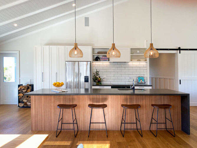 country home kitchen with white cabinetry and timber island