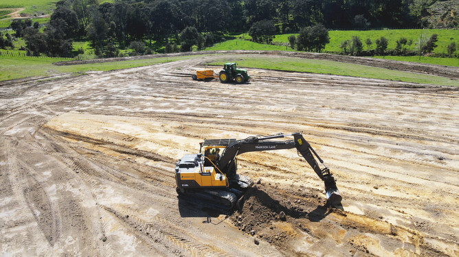 14 tonne digger moves earth at a rural construction project