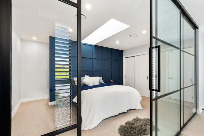 Master bedroom suite with feature timber wall