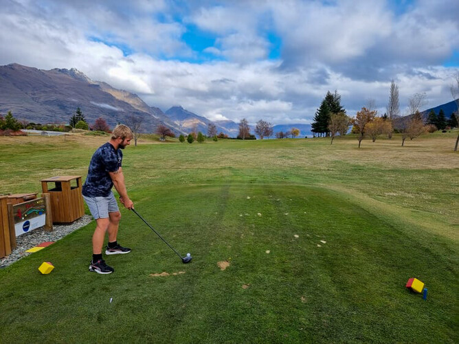 Will lining up his shot on the golf course