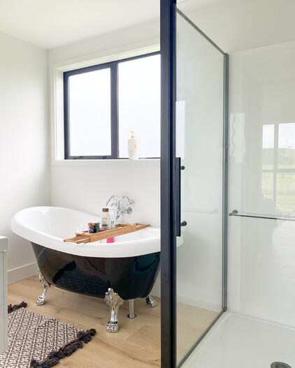 Bathroom with black claw foot freestanding bath