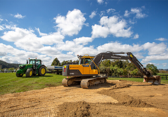 Dark kitchen with metallic pendants