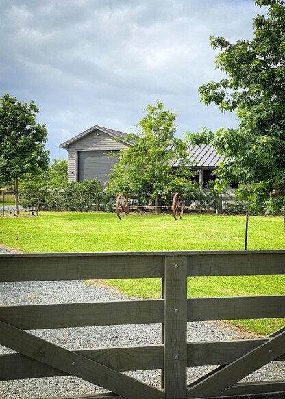 Stables tucked behind trees