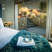 Interior bedroom view looking out to the Mackenzie landscape at SkyScape