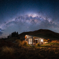 Glass-roof cabin beneath the Milky Way in the Dark Sky Reserve