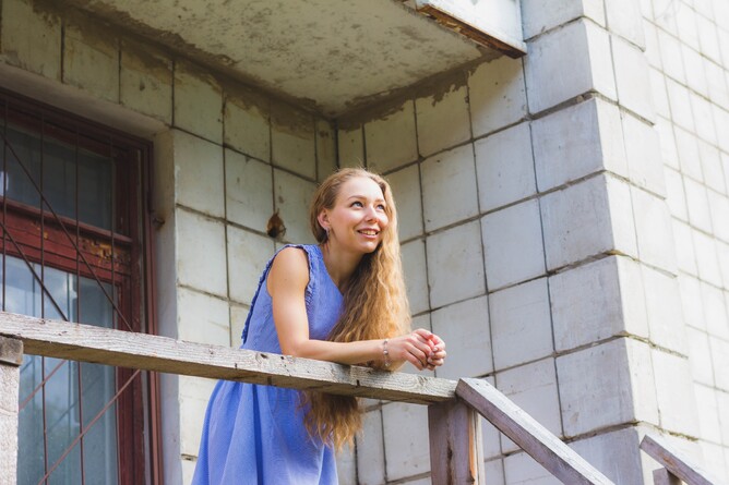 Woman leaning against banister