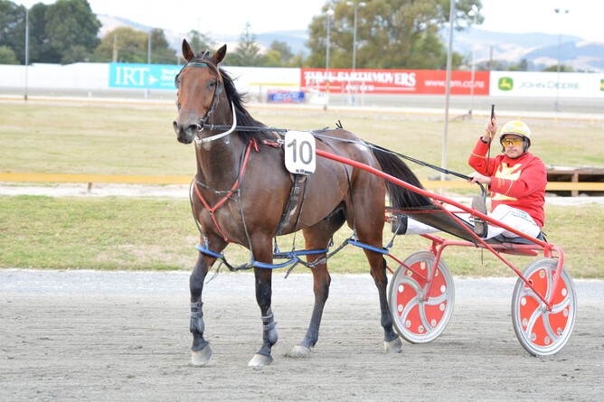 Kevin Hall salutes behind J Bee - Photo: Chanelle Lawson Photography