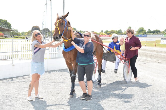 Still Eyre is greeted by Ellie Rowden (right) after winning at The Raceway - Photo: Chanelle Lawson