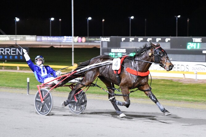 Zev Meredith celebrates after winning at the Cambridge Raceway with Whooshka. - Photo: Chanelle Lawson