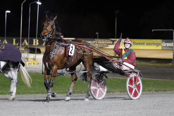 Reinswoman Crystal Hackett salutes following her 50th win on Thursday night. - Photo: Angelique Bridson