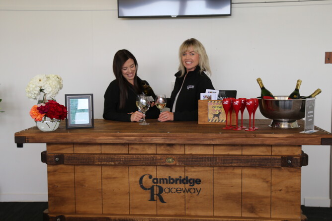 Robyn Gurney and Shannon Bint-Popplewell with one of the new Black Dog Furniture leaners in the Winner's Lounge
